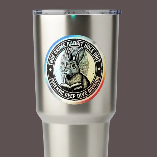 Circular logo with a rabbit holding a book, labeled 'True Crime Rabbit Hole Unit' on a tumbler.